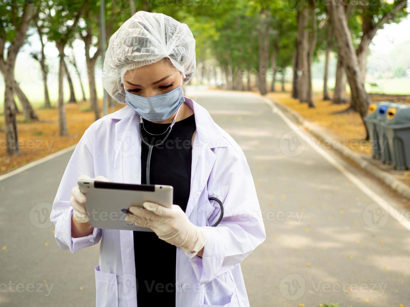 Scientist nurse doctor uniform work job caree occupation research looking natural leaf environment tablet smartphone mobile technology future green clean energy farm laboratory lifestyle professional photo
