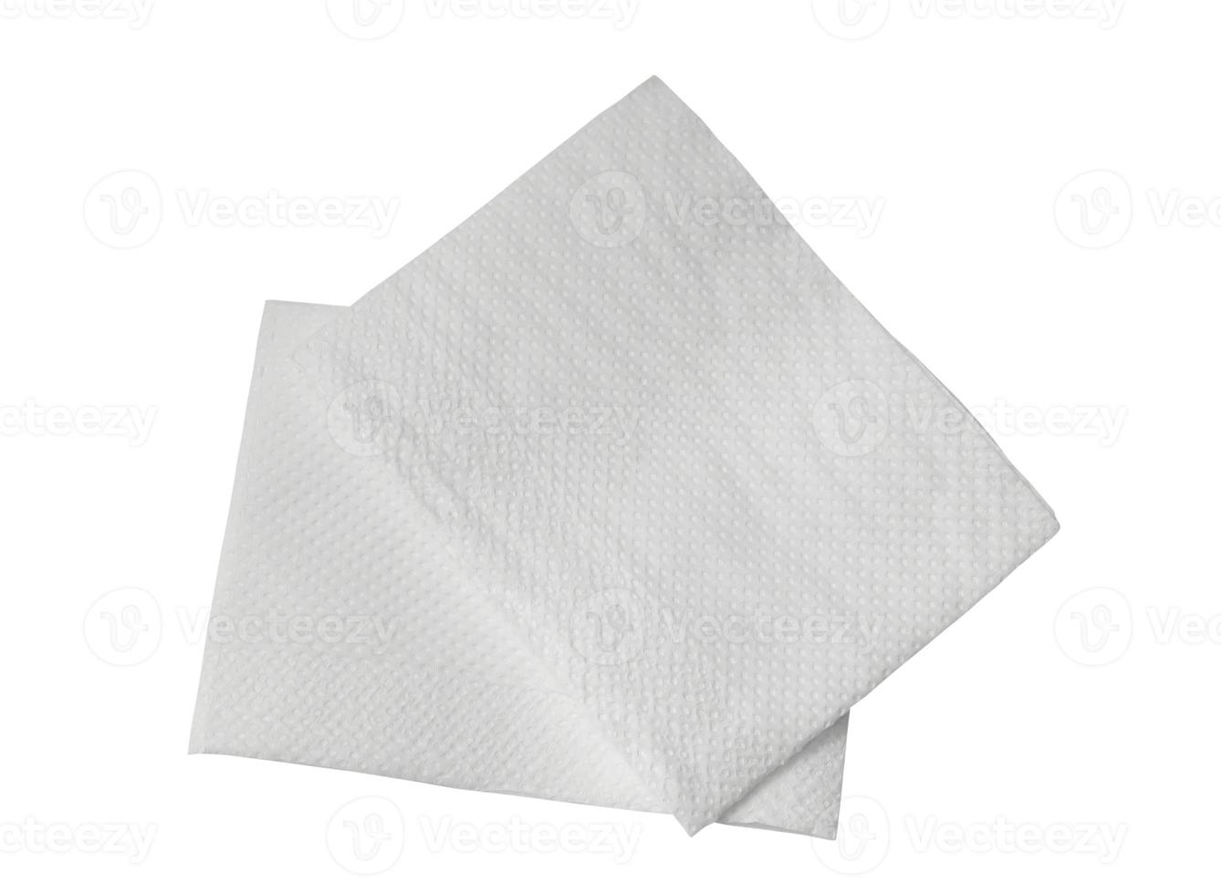 Two folded pieces of white tissue paper or napkin in stack isolated on white background with clipping path photo
