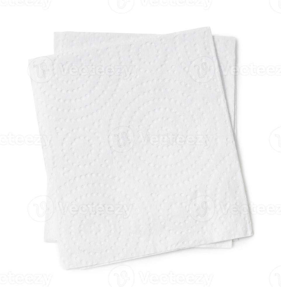 Two folded pieces of white tissue paper or napkin in stack isolated on white background with clipping path photo