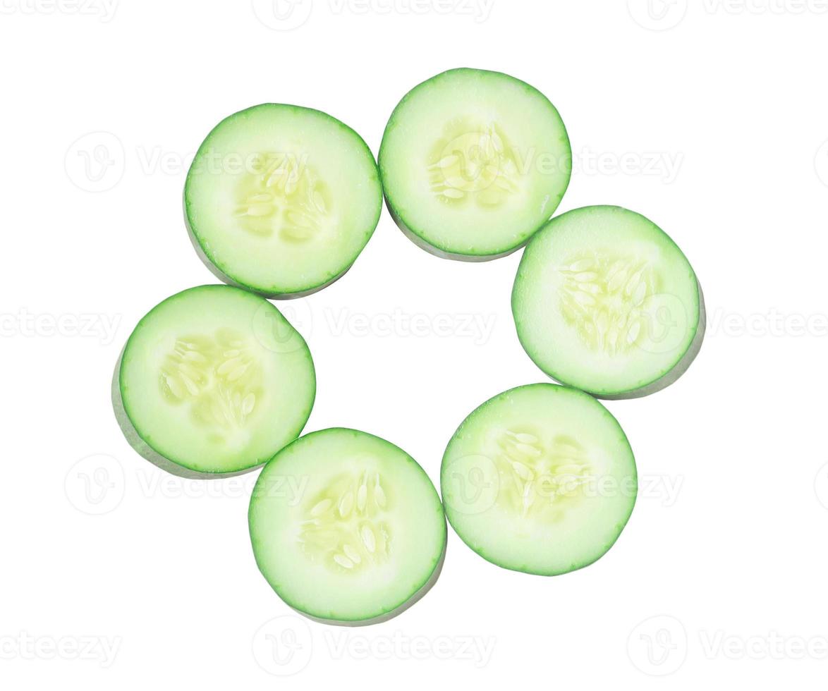 Top view of fresh cucumber slices isolated on white background photo