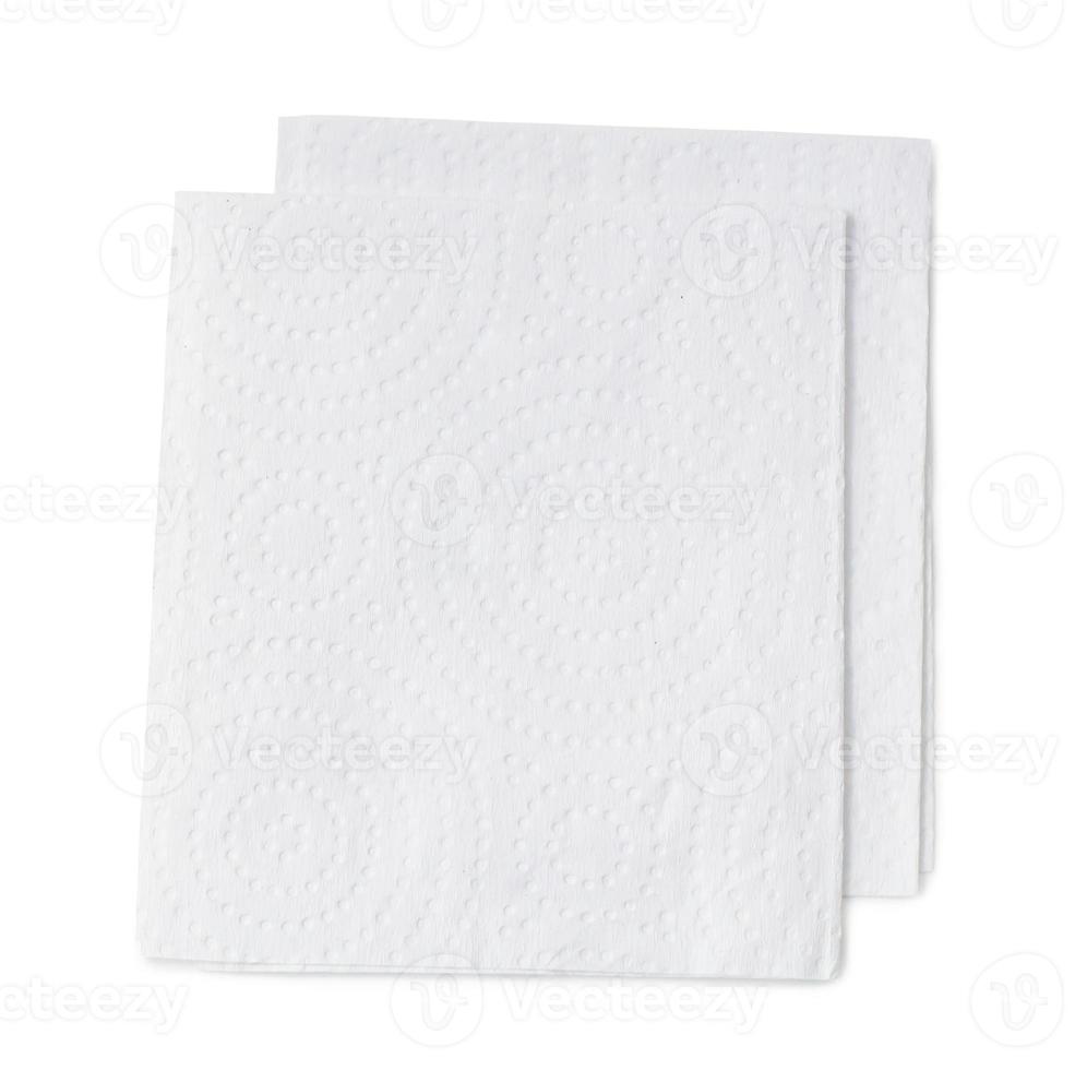 Two folded pieces of white tissue paper or napkin for use in toilet or restroom in stack isolated on white background with clipping path photo