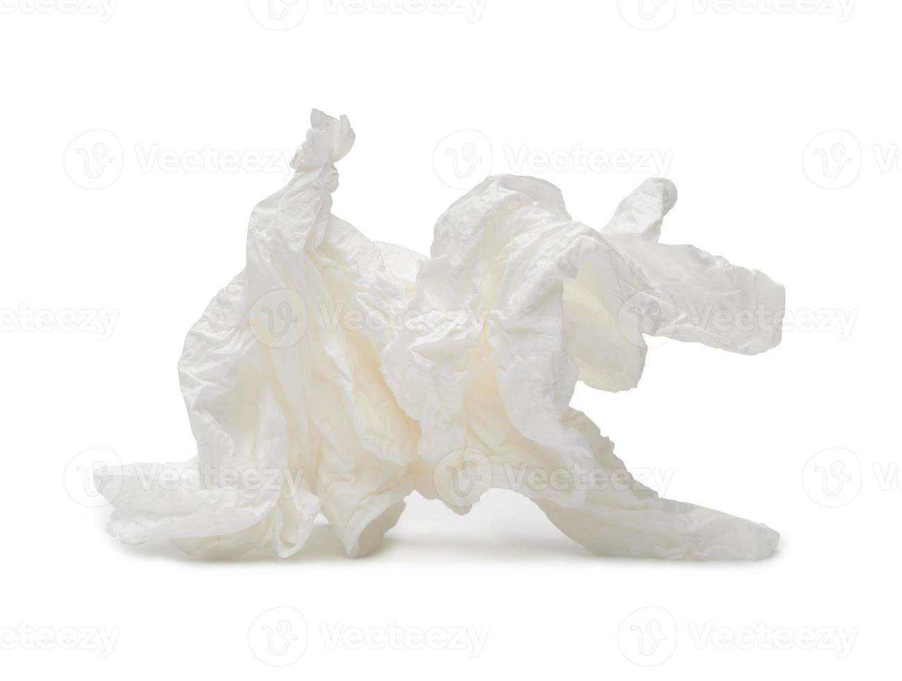 Single white screwed or crumpled tissue paper or napkin in strange shape after use in toilet or restroom isolated on white background with clipping path photo