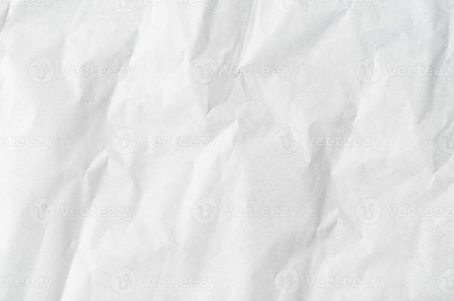 Wrinkled or crumpled white stencil paper or tissue used for background texture photo