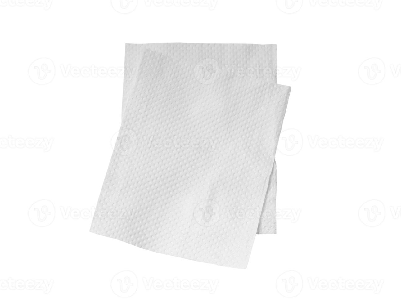 Two folded pieces of white tissue paper or napkin in stack isolated on white background with clipping path photo