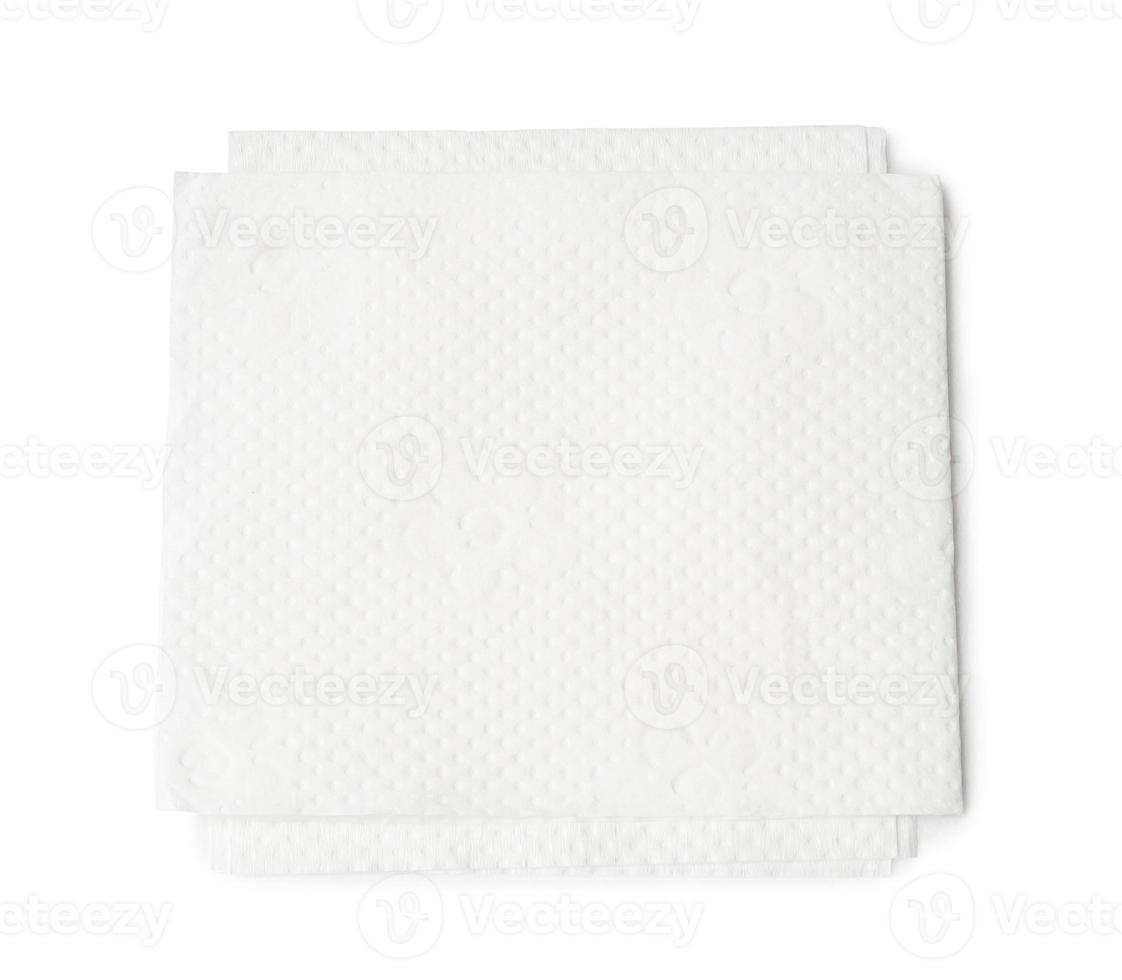Two folded pieces of white tissue paper or napkin for use in toilet or restroom in stack isolated on white background with clipping path photo