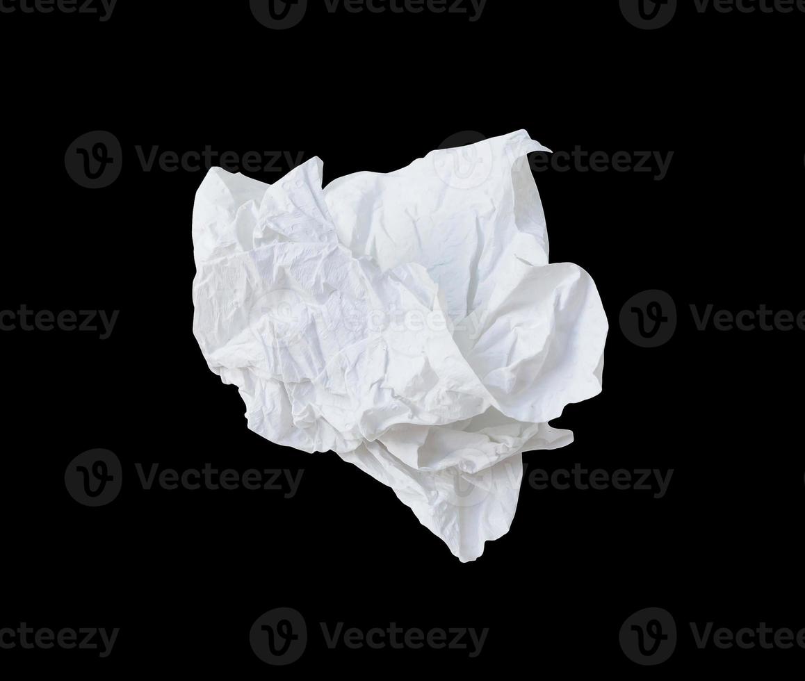 Single wrinkled or crumpled tissue paper or napkin in strange shape after use in toilet or restroom isolated on black background with clipping path photo
