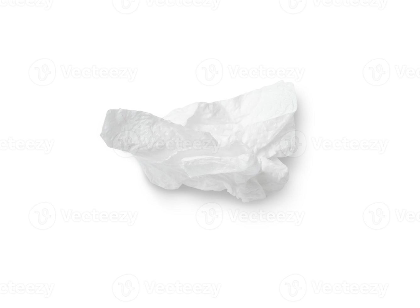 Single screwed or crumpled tissue paper after use isolated on white background with clipping path photo