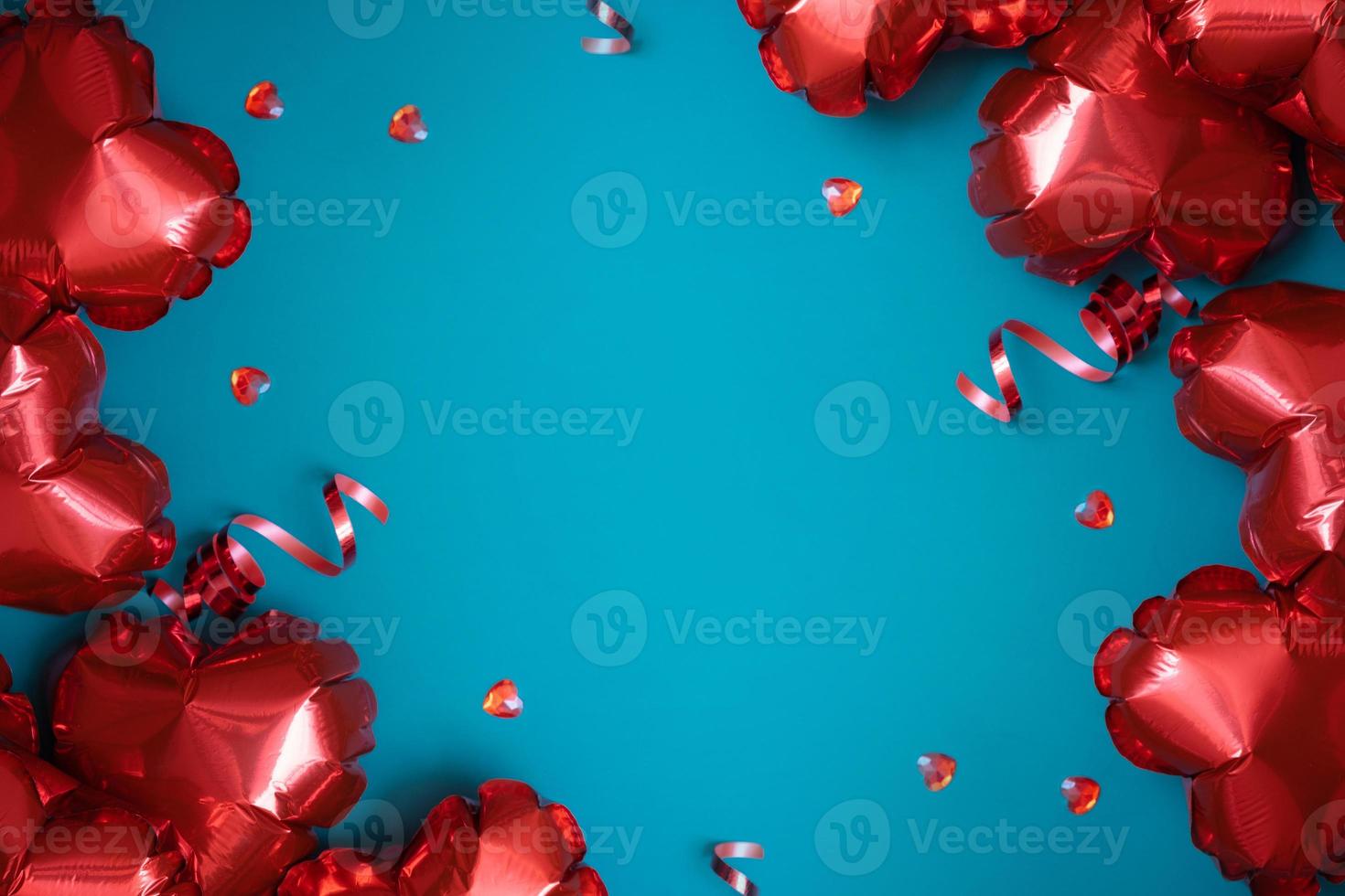 Red heart shape baloons on turquoise background. Valentines Day greeting card. Copy space photo