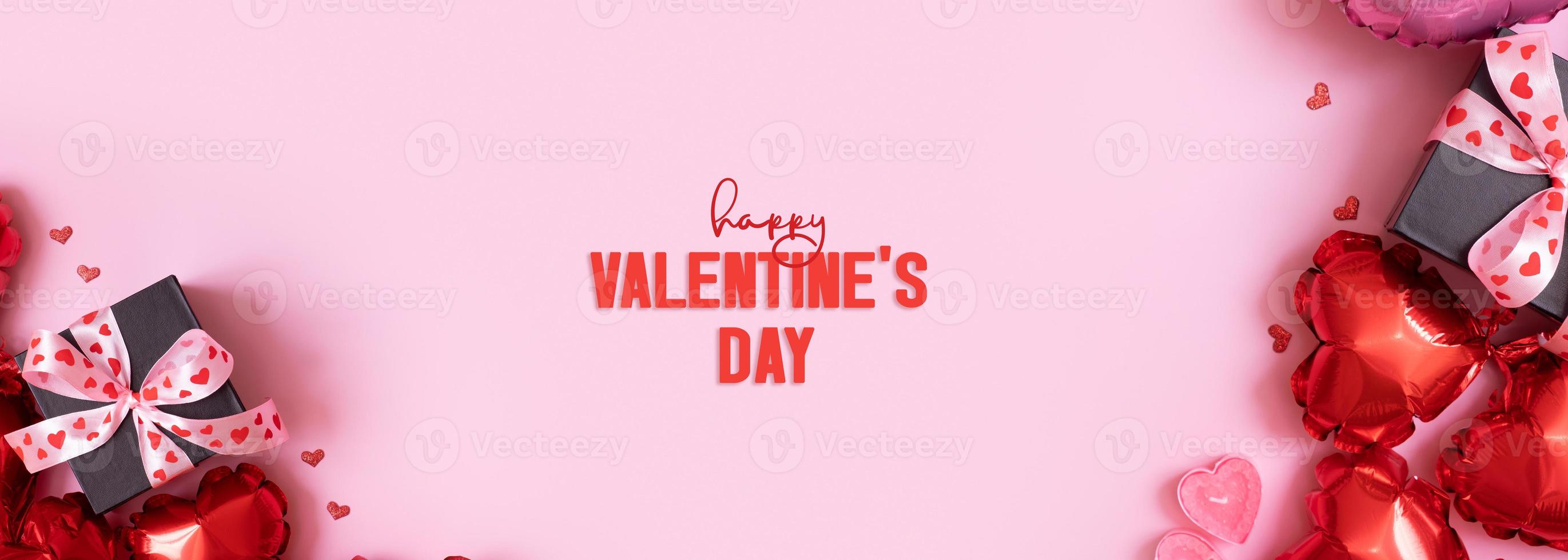 Happy Valentines Day text on greeting card. Banner with gift box with bow and heart shape baloons on pink background photo