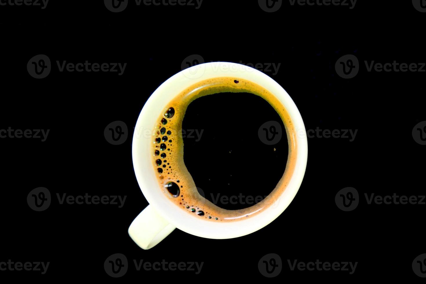 Cup of black coffee on black table photo