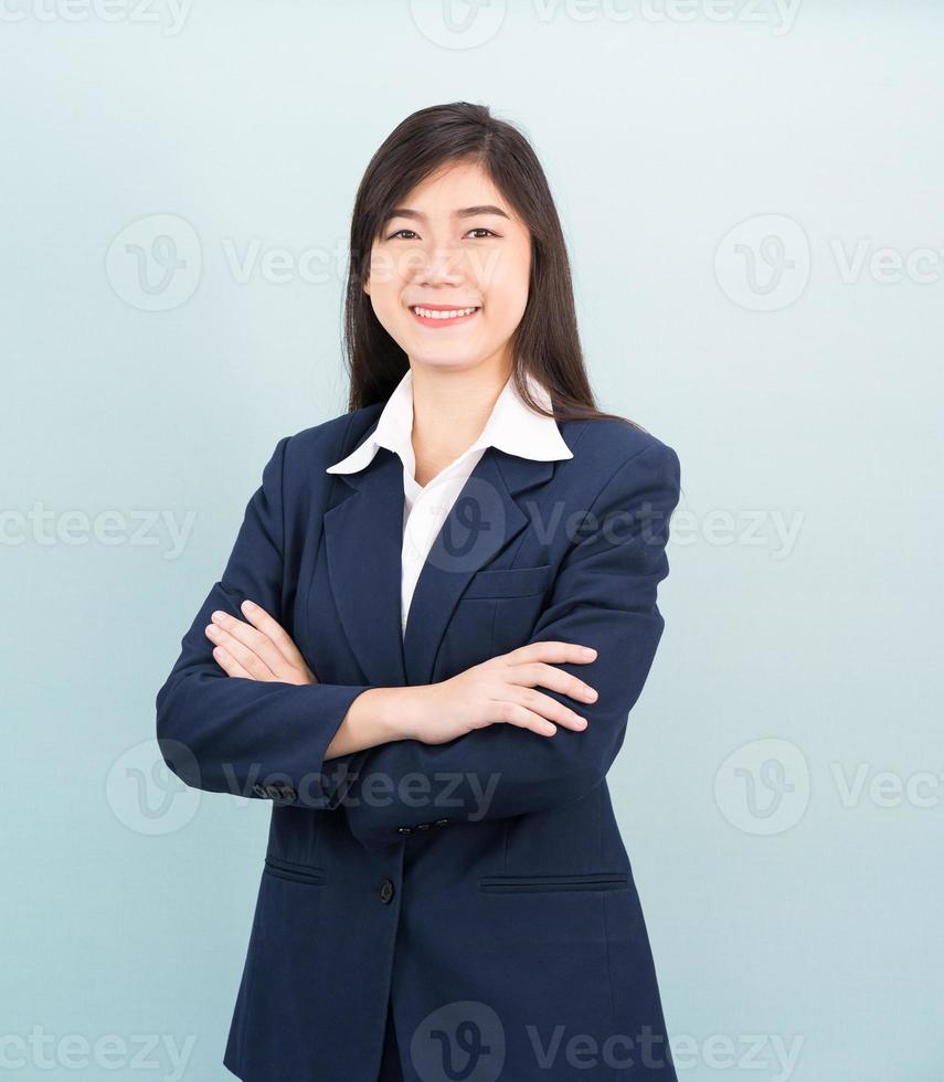 Teenage girl long hair is standing with her arms crossed photo