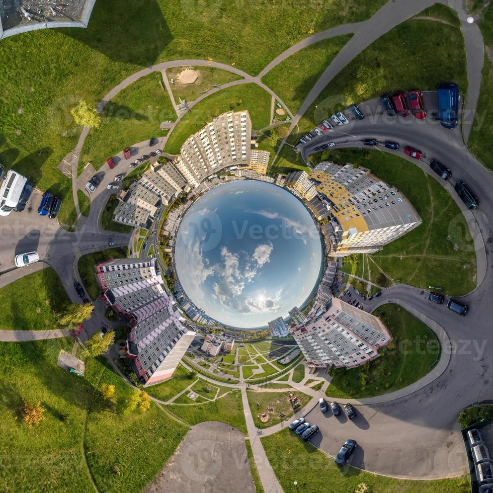 blue sphere inside overlooking old town, urban development, historic buildings and crossroads with cars. Transformation of spherical 360 panorama in abstract aerial view. photo