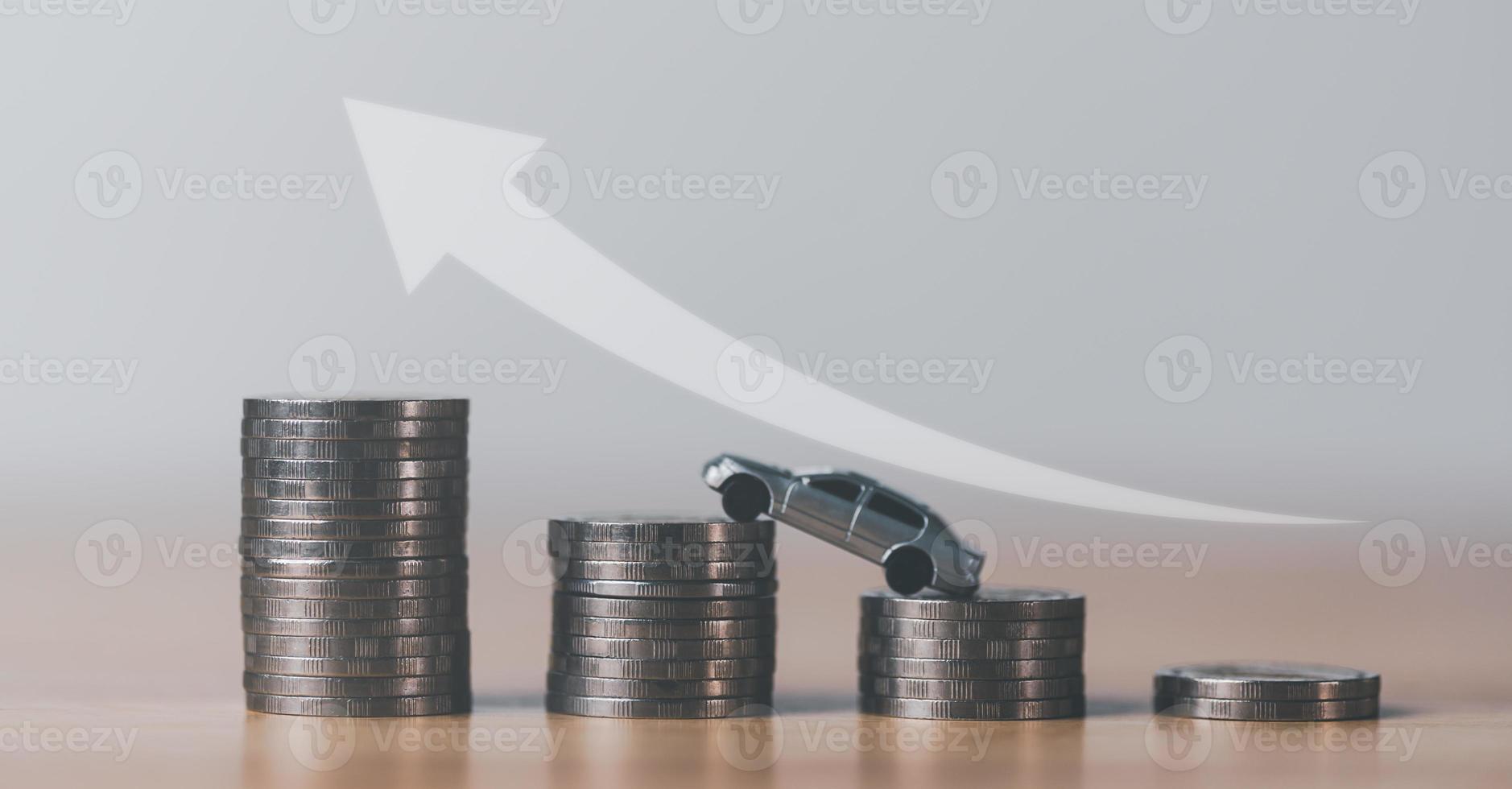 Stacks of coins and toy cars on the table,The idea of saving money to buy a new car,car insurance business ,credit planning,Saving money and preparation for future care and maintenance photo