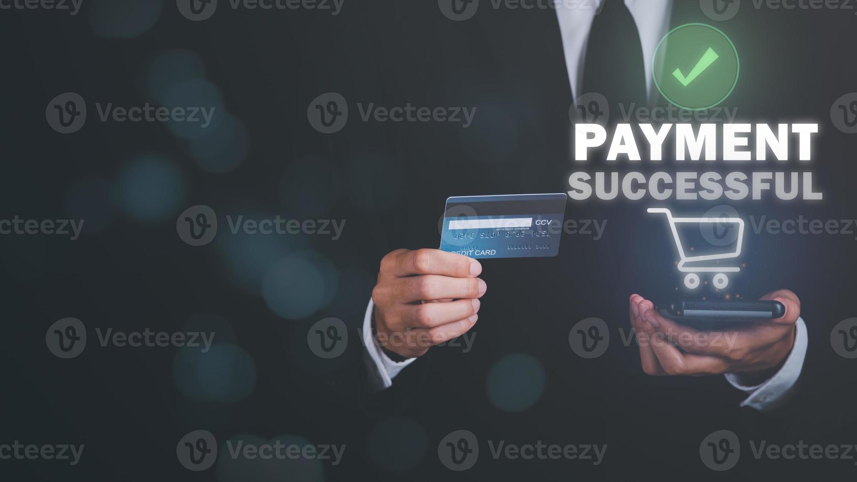Young businessman using credit card to make financial transactions via smartphone, payment concept with wireless communication technology, focus on consumer safety and cashlessness,successful payment photo