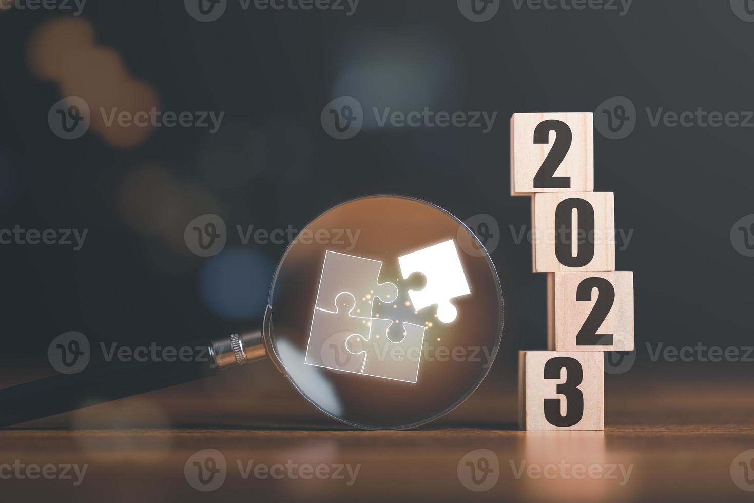 solution concept,demonstrating leadership strategies,Creativity that will lead business in right direction,with innovation ,brain power from brainstorming,Magnifying glass and wooden blocks on table photo