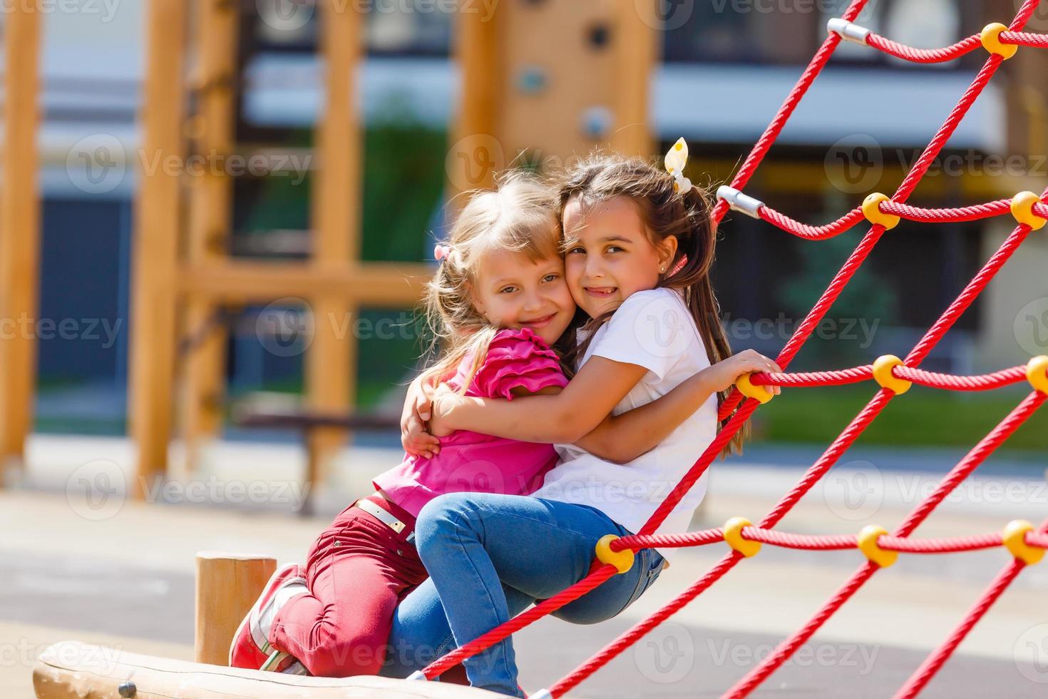 two little girls on the playground photo