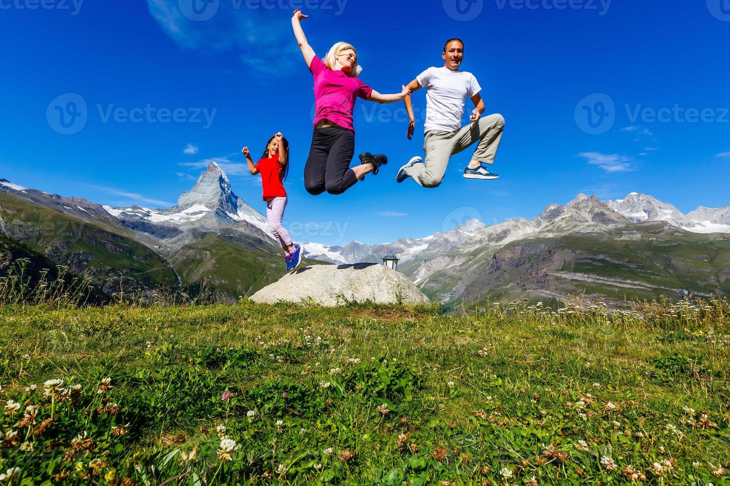 Family on their vacation in mountains photo
