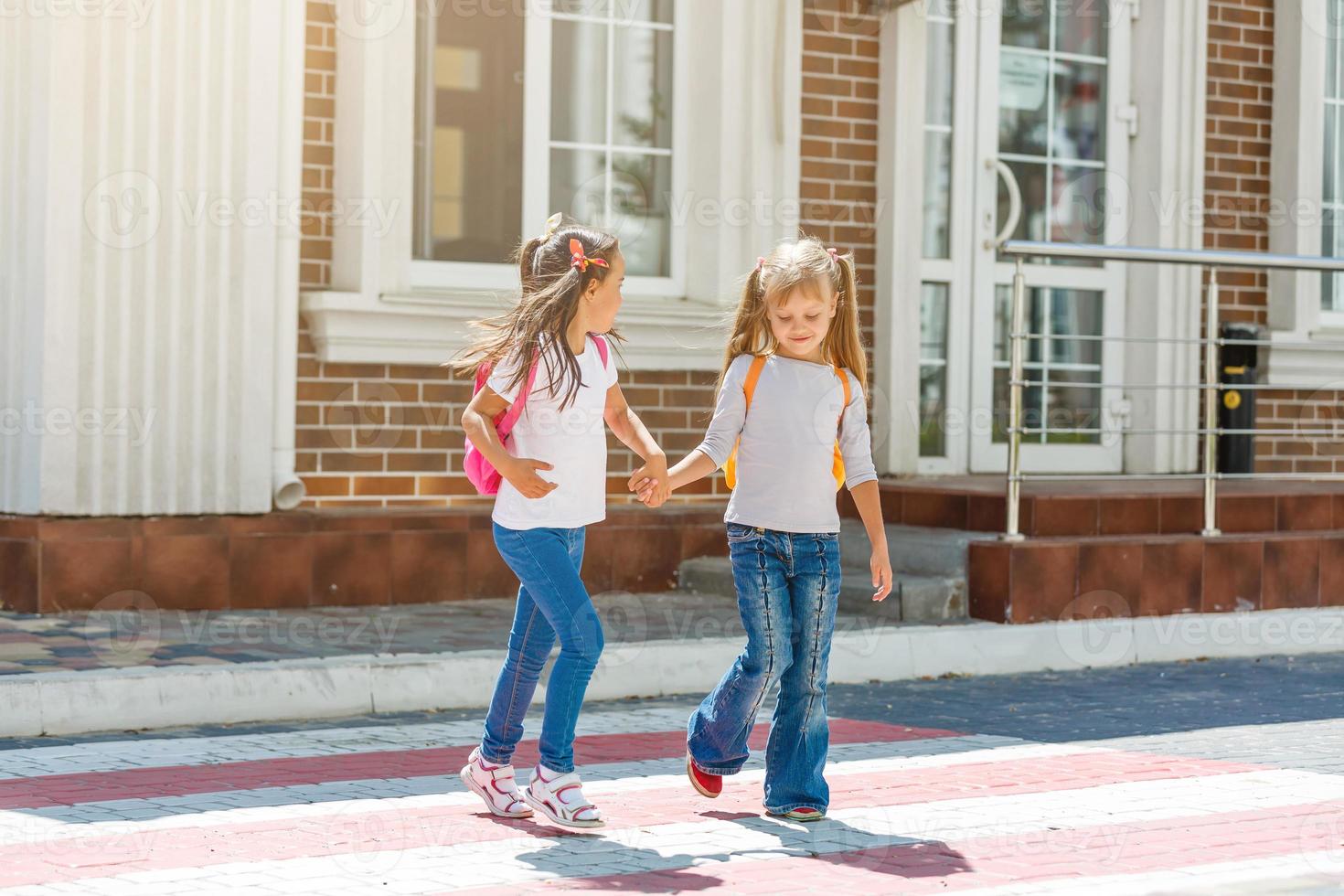 Basic school students crossing the road photo