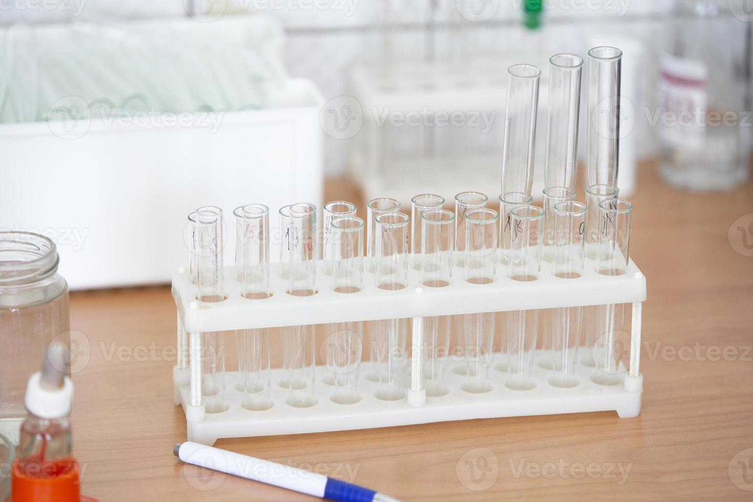Empty flasks in a biochemical laboratory. Test tubes for analysis. photo