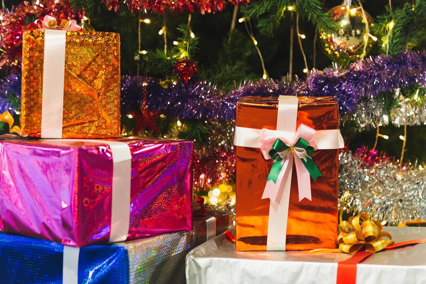 Christmas gift boxes with ribbon and Christmas decorations celebrate New Year and Christmas season. photo