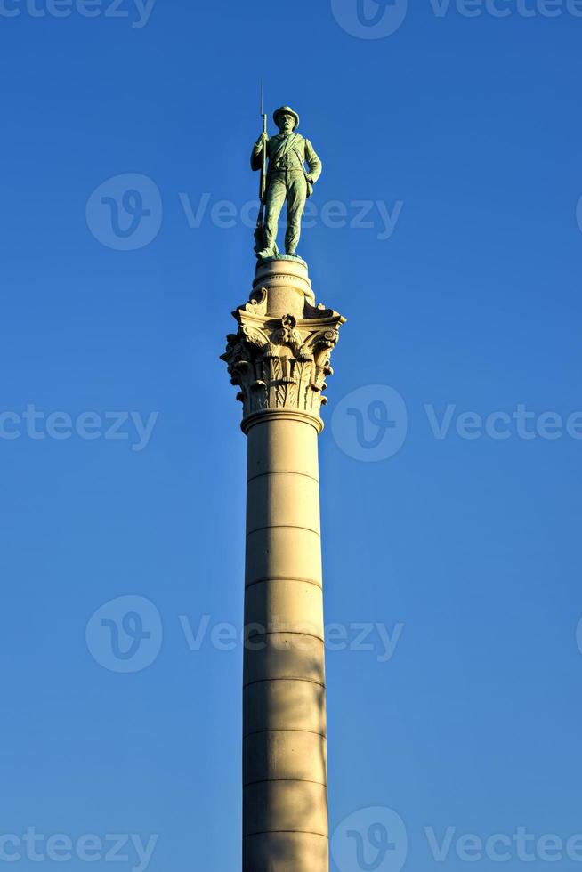 Confederate Soldiers' and Sailors' Monument. It depicts a bronze Confederate private standing on top of the pillar, which is composed of 13 granite blocks to symbolize each of the Confederate states. photo