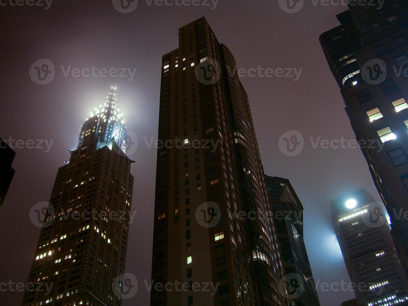 New York City skyscrapers at night on a foggy evening in Midtown Manhattan. photo