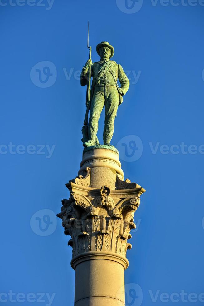 Confederate Soldiers' and Sailors' Monument. It depicts a bronze Confederate private standing on top of the pillar, which is composed of 13 granite blocks to symbolize each of the Confederate states. photo