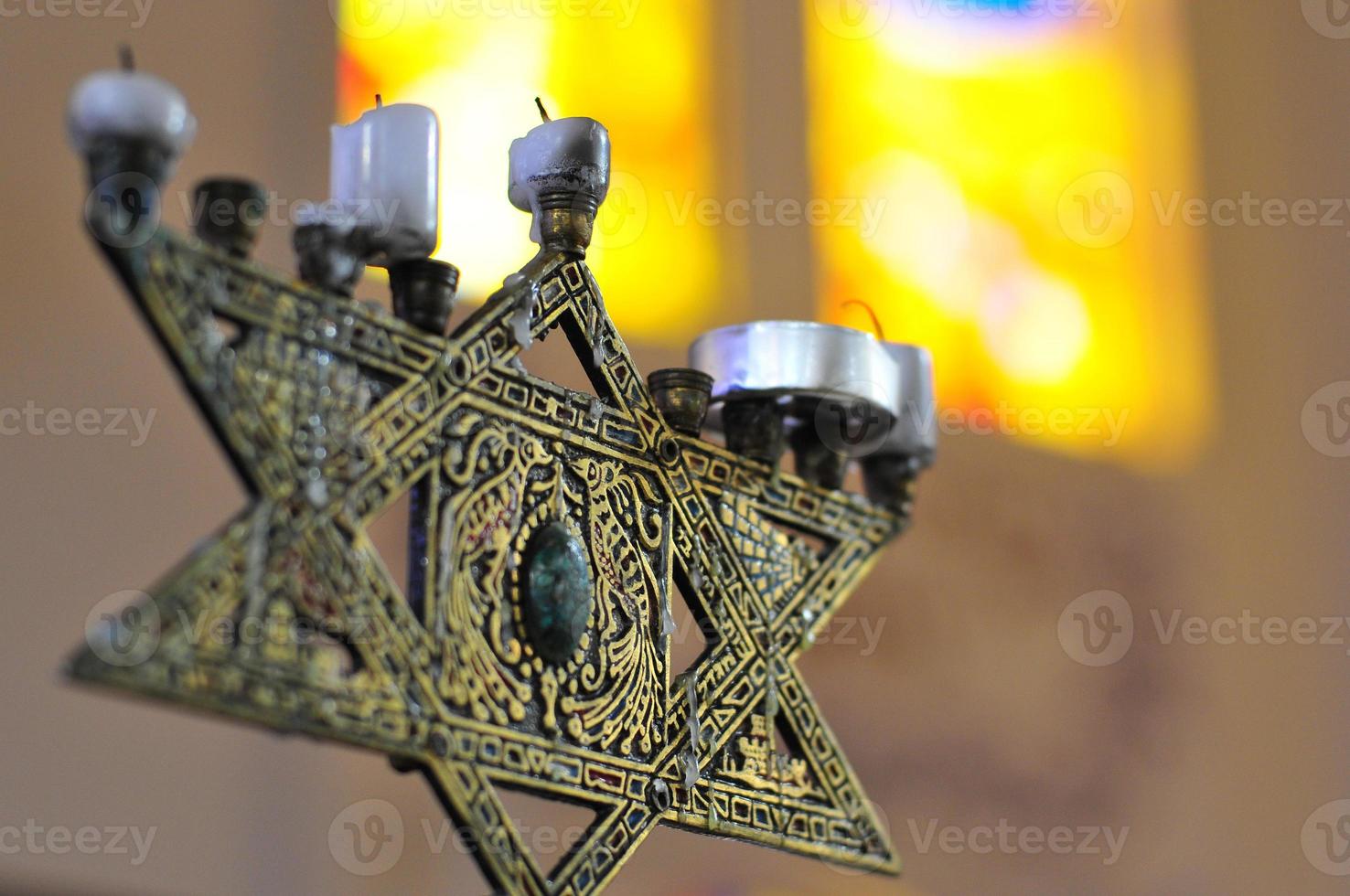 Star of David in the fashion of a menorah with candles. photo