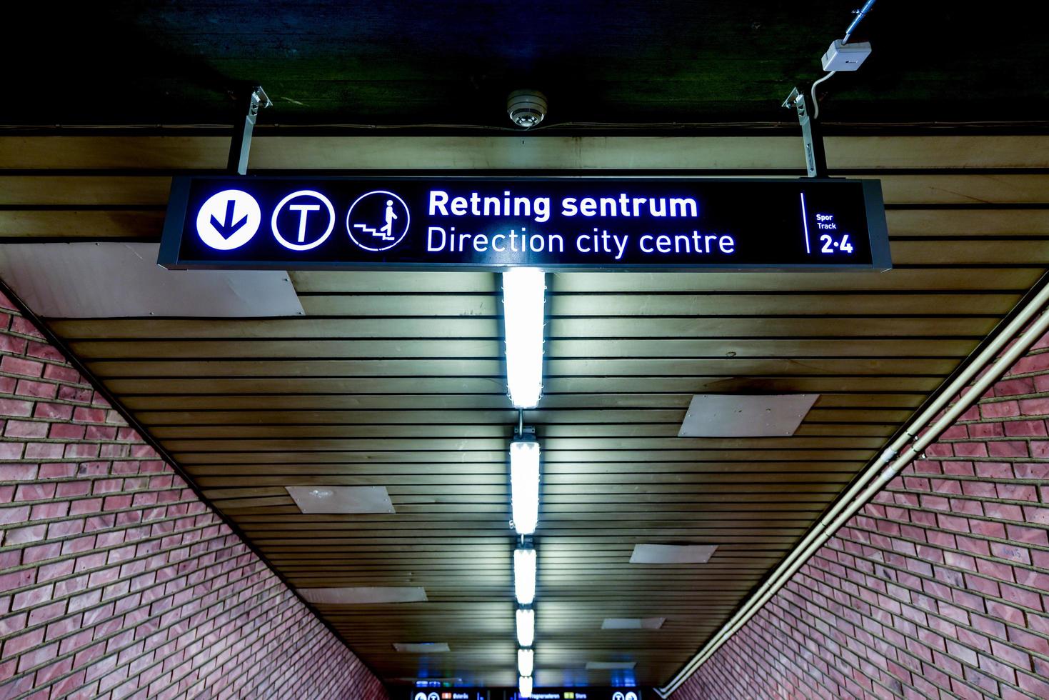Oslo, Norway - February 28, 2016 -  Oslo subway. Sign leading to the city centre. photo