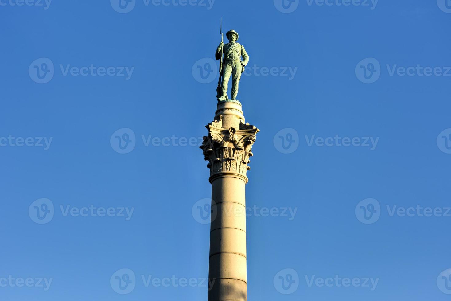 Confederate Soldiers' and Sailors' Monument. It depicts a bronze Confederate private standing on top of the pillar, which is composed of 13 granite blocks to symbolize each of the Confederate states. photo