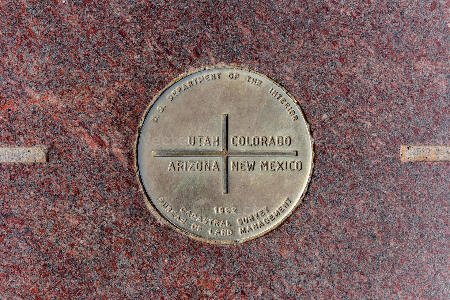 The Four Corners Monument marks the quadripoint in the Southwestern United States where the states of Arizona, Colorado, New Mexico, and Utah meet. photo