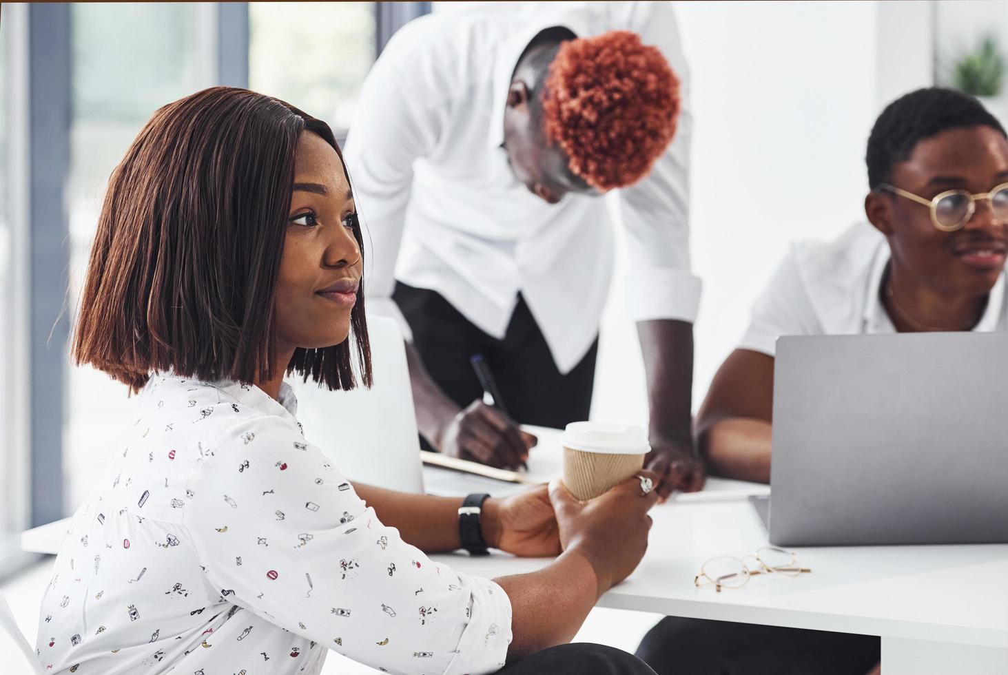 Group of african american business people working in office together photo