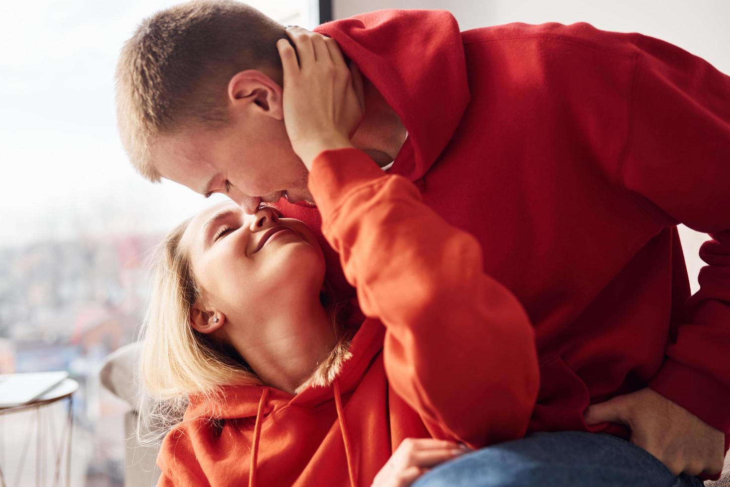 Closeness of people. Young lovely couple together at home spending weekend and holidays together photo