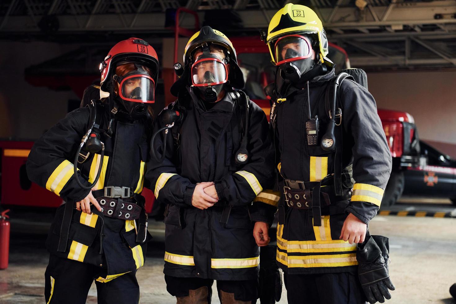 Group of firefighters in protective uniform that is on station photo