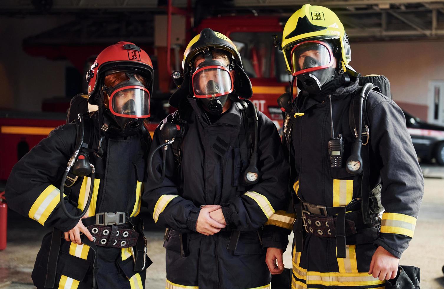 Group of firefighters in protective uniform that is on station photo