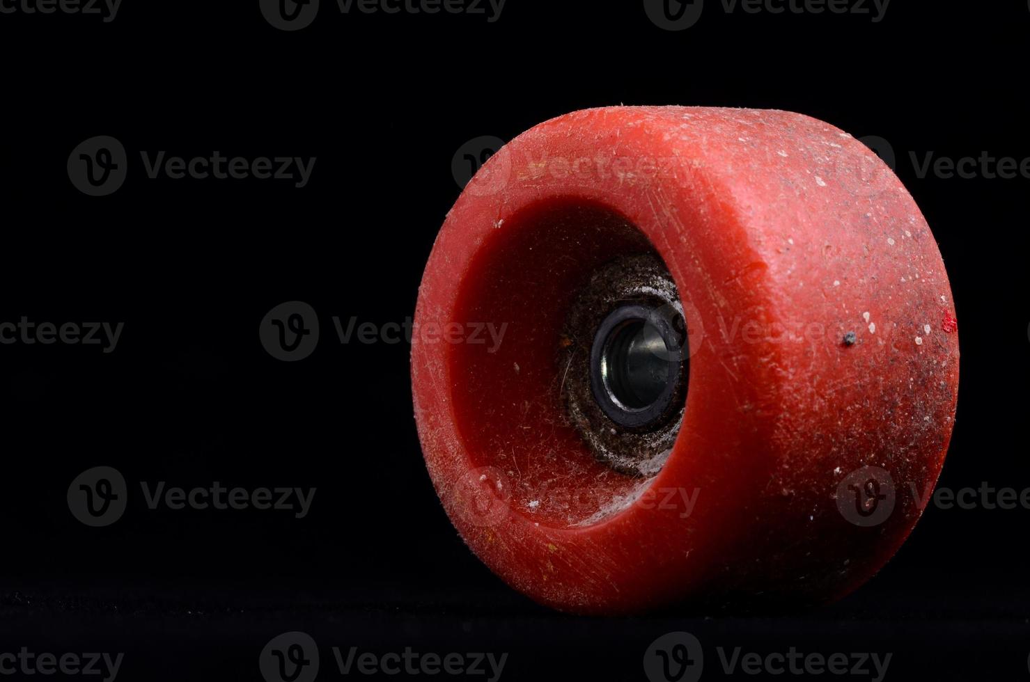 Skate wheel on black background photo