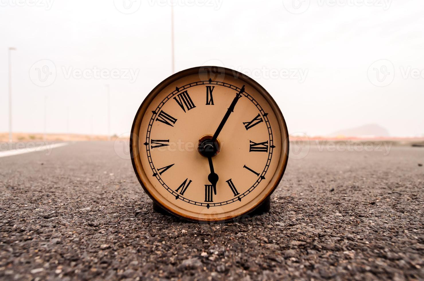 Clock on the ground photo