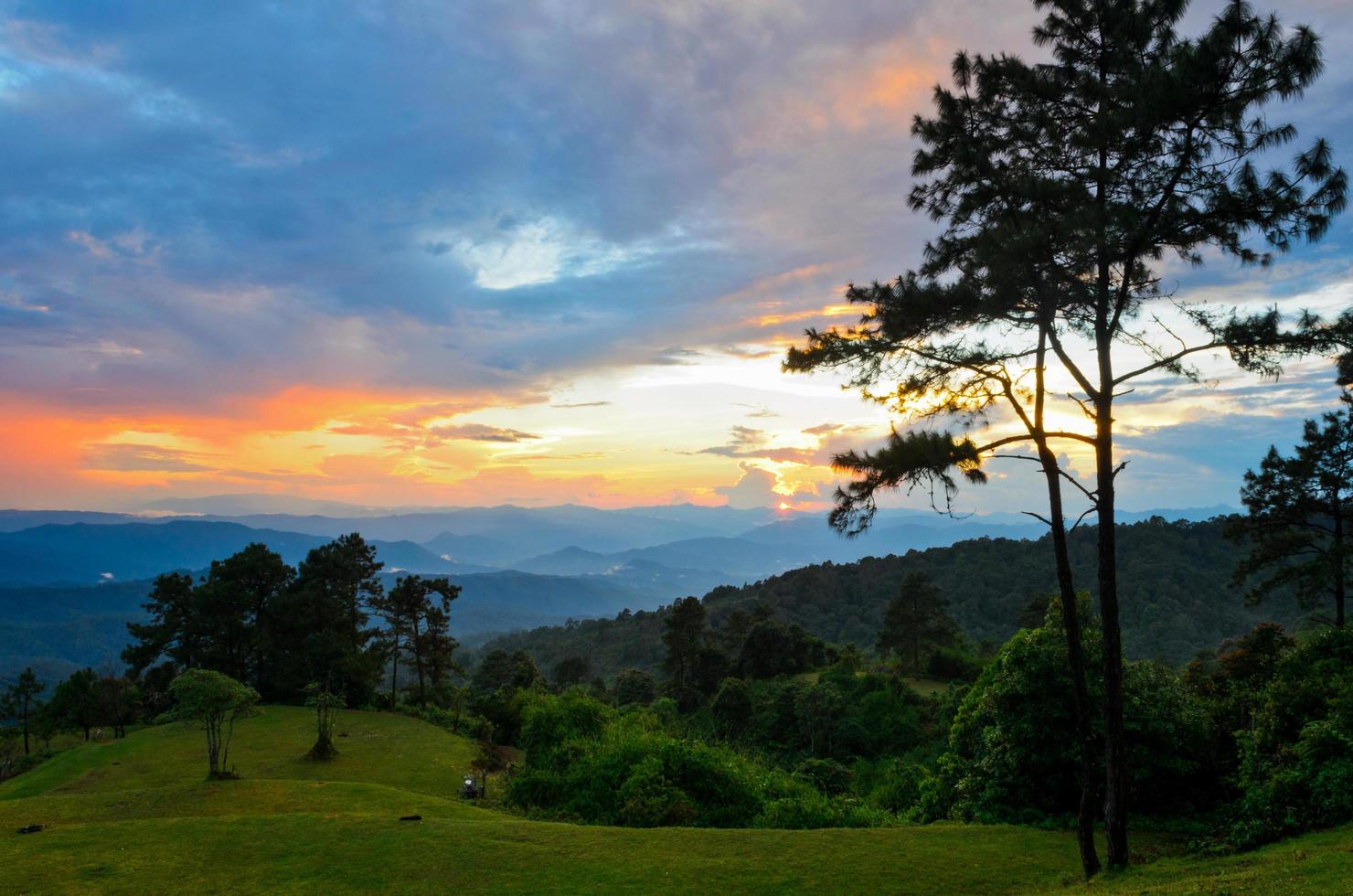 Sunset over high mountain range photo