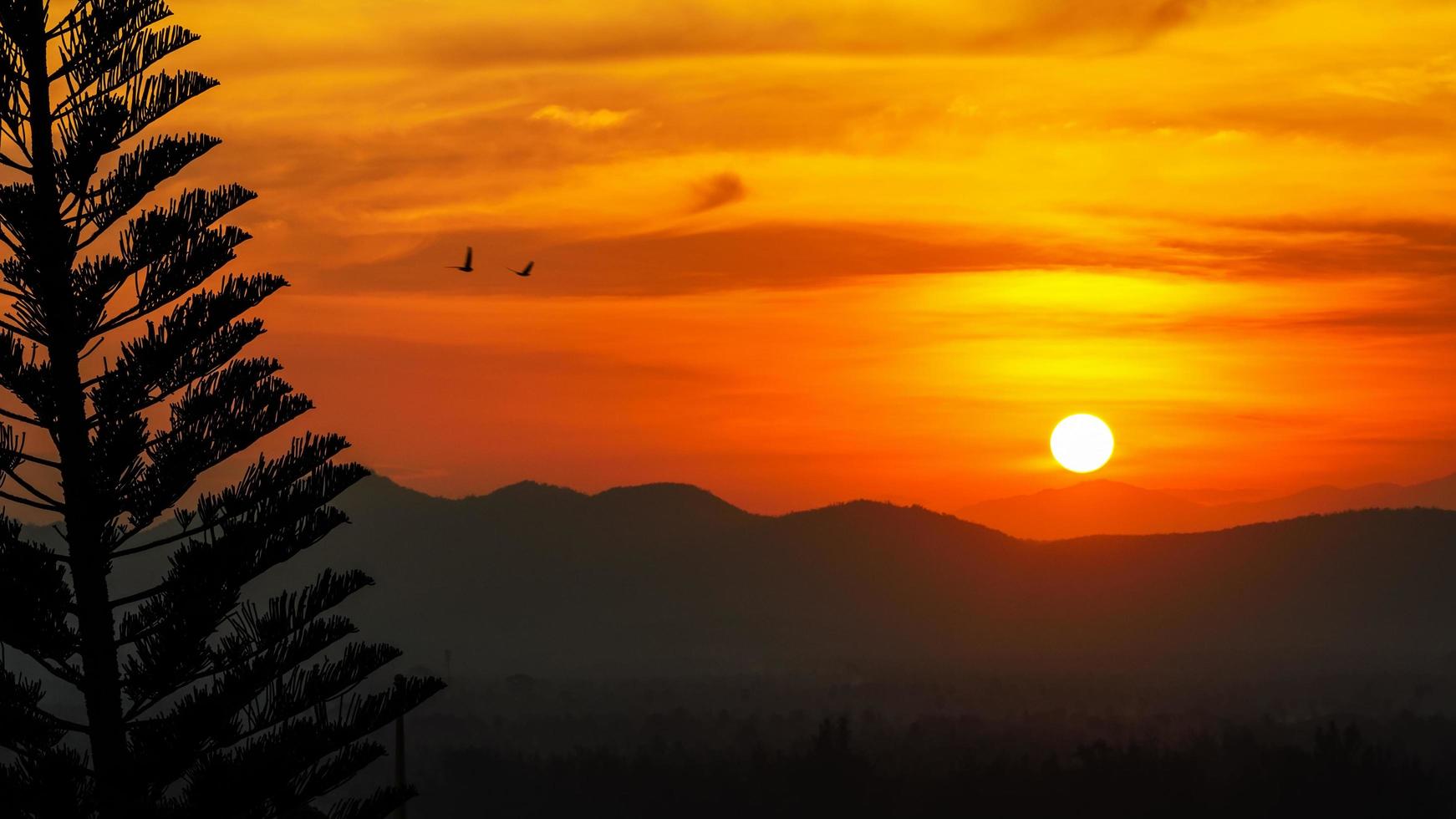 Sunset over mountain range photo