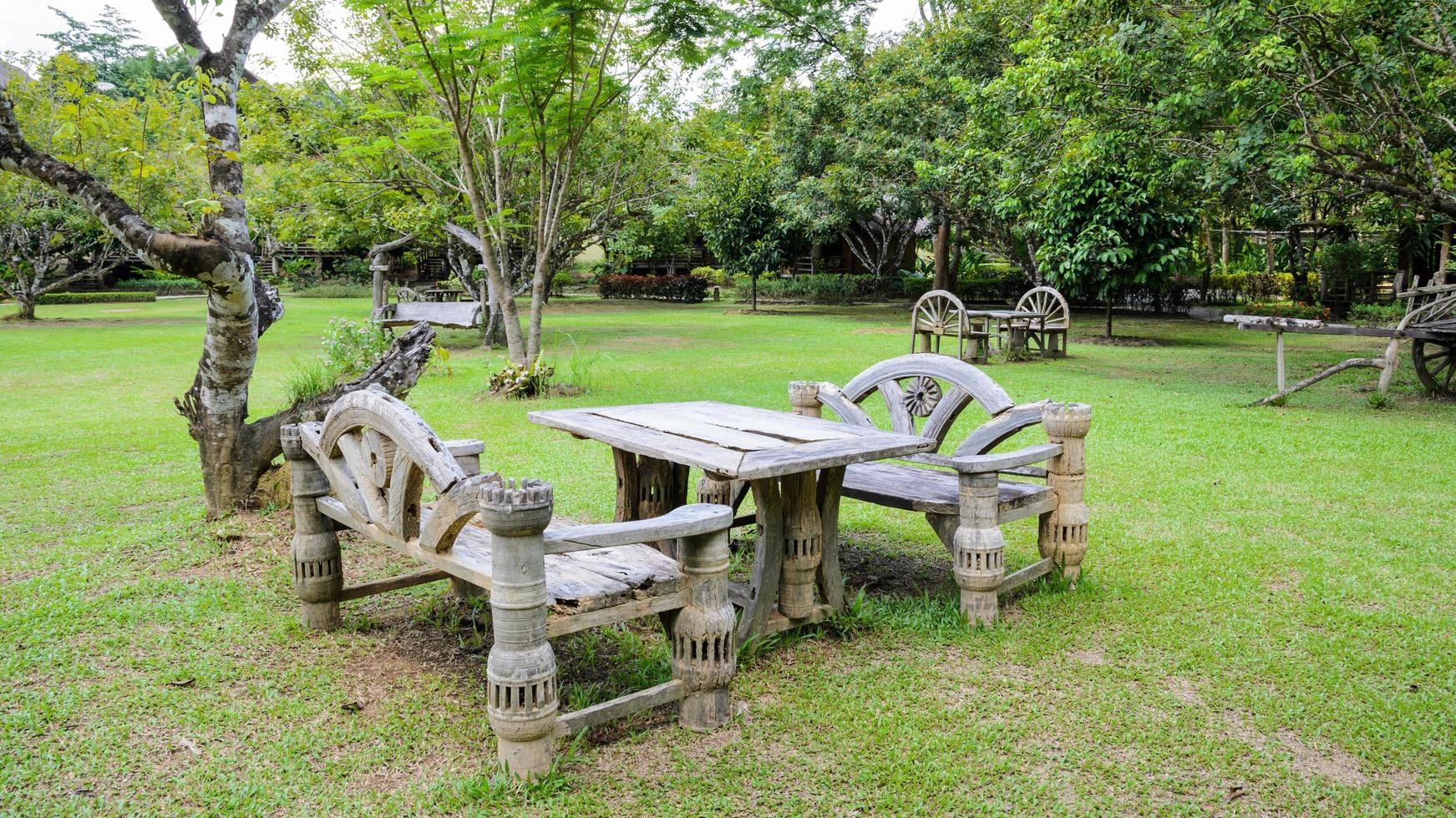 Old wooden seats in garden photo