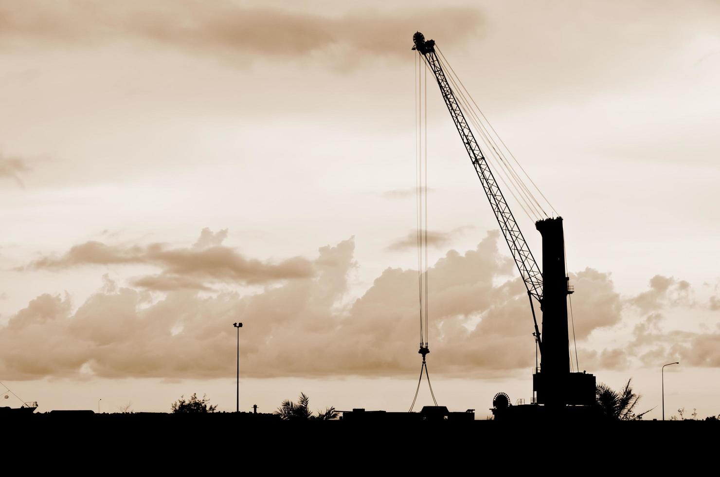 Harbor crane on the sea photo