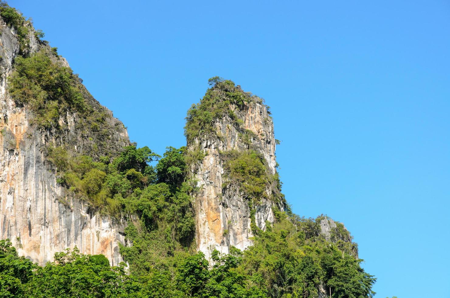 High cliffs on blue sky photo