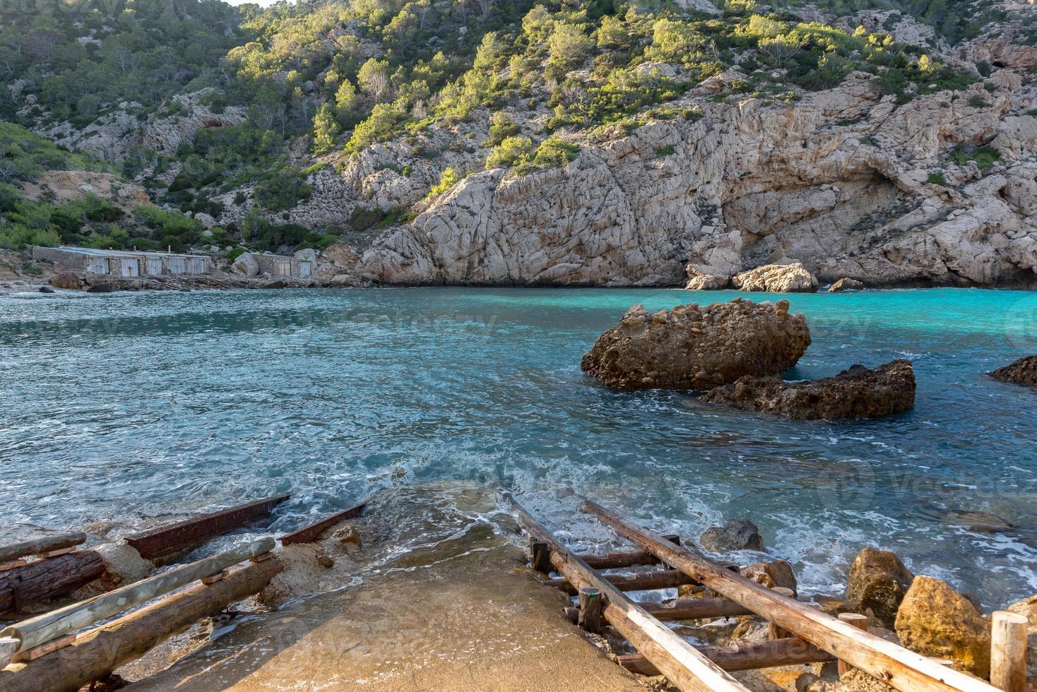 Turquoise waters in Es Portitxol, Ibiza, Spain. Hidden bay on the Island of Ibiza, in Sant Joan de Labritja. photo