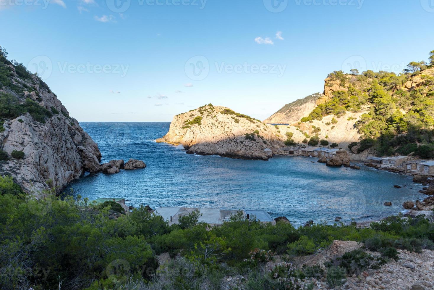 Turquoise waters in Es Portitxol, Ibiza, Spain. Hidden bay on the Island of Ibiza, in Sant Joan de Labritja. photo