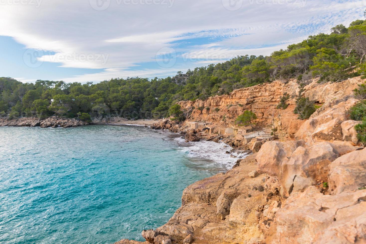 Cala Salada and Saladeta in san Antonio Abad at Balearic Islands Spain. Long exposure, Typical house for fishing boats and rocks. photo