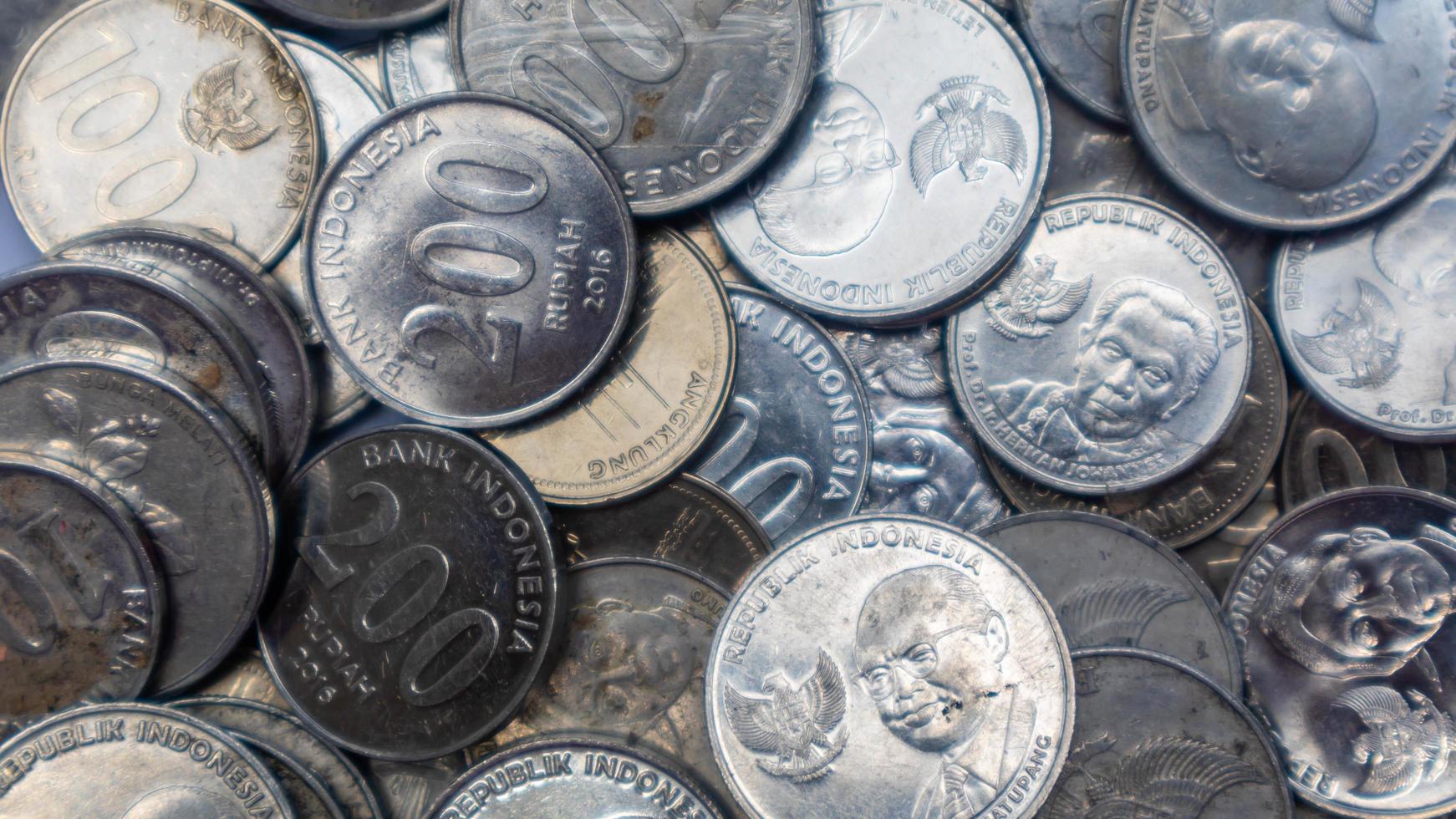 pile of rupiah coins as background photo