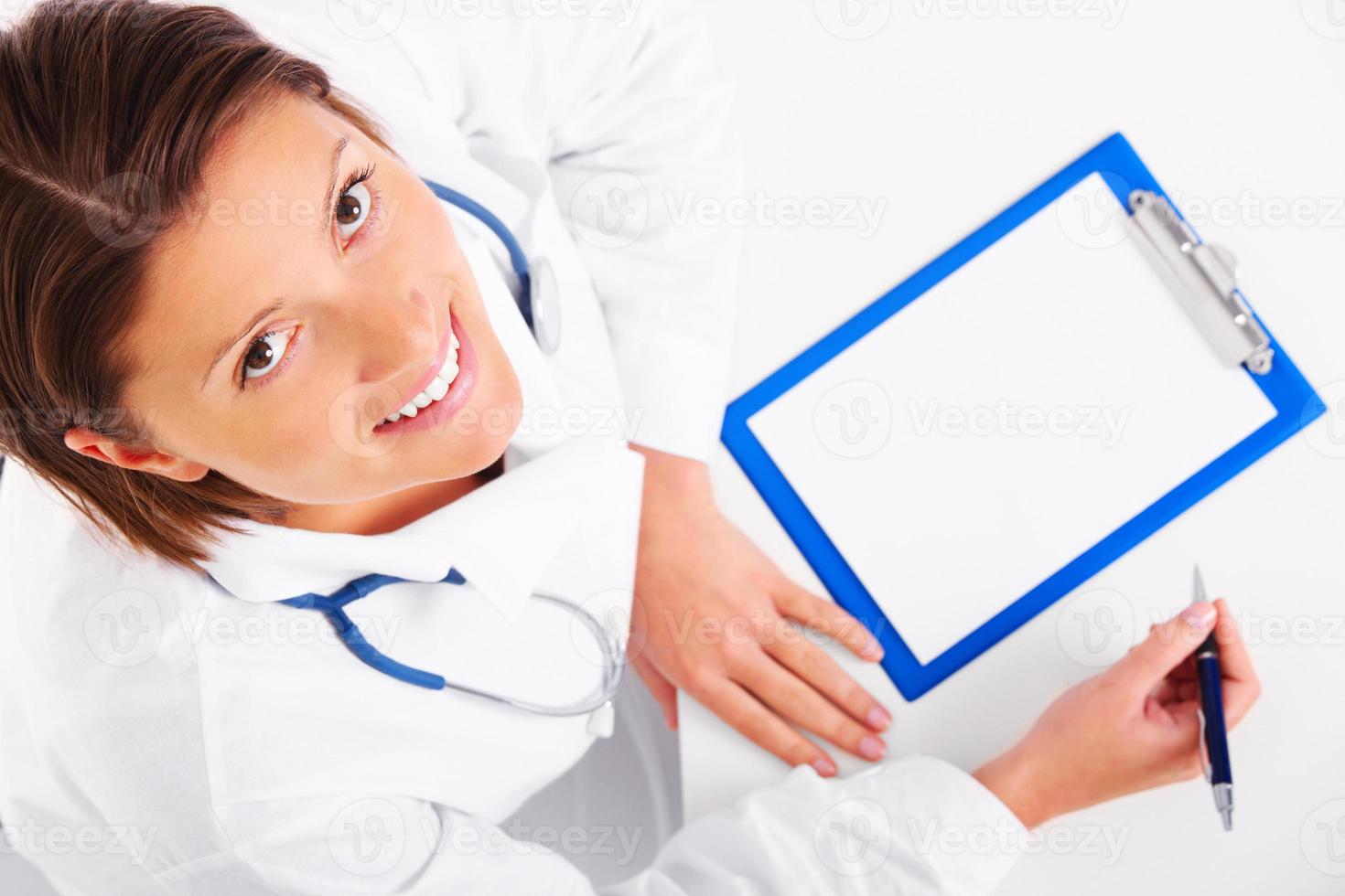 Young doctor with stethoscope photo