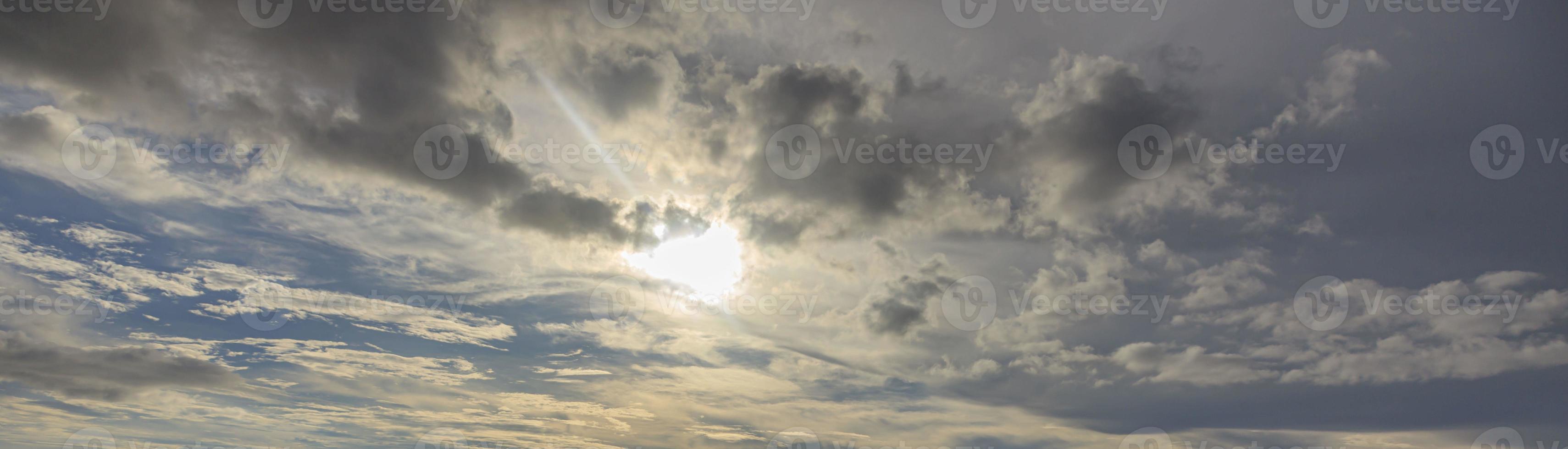 Image of a partly cloudy and partly clear sky during the day photo