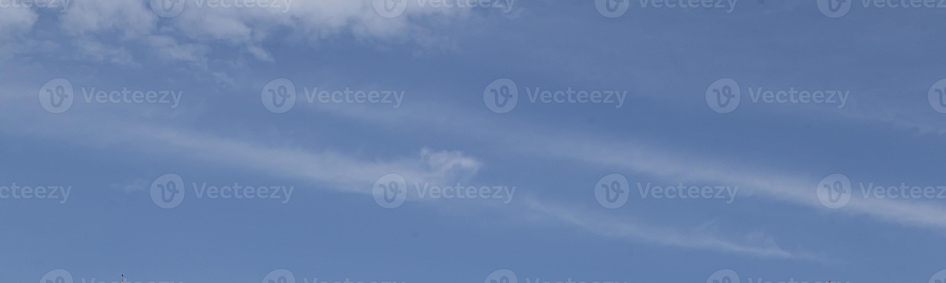 Image of a partly cloudy and partly clear sky during the day photo