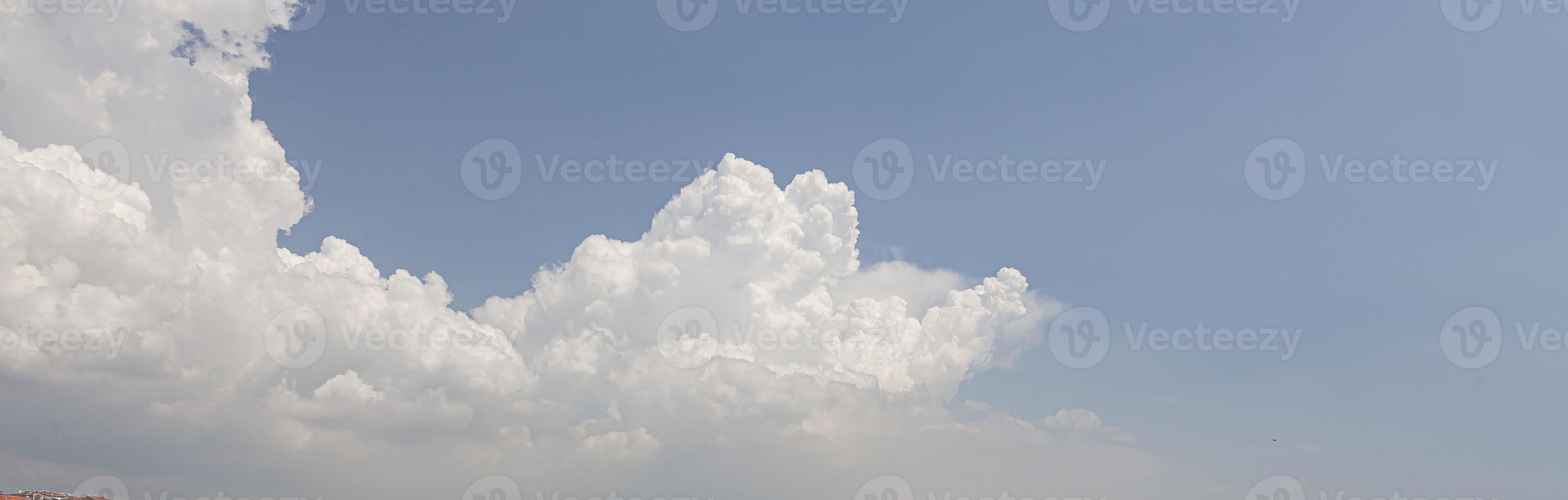 Image of a partly cloudy and partly clear sky during the day photo